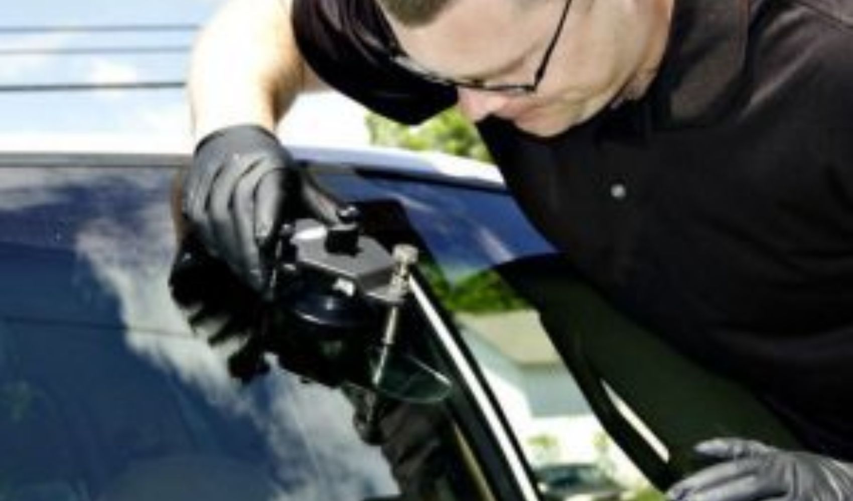 man installing windshield